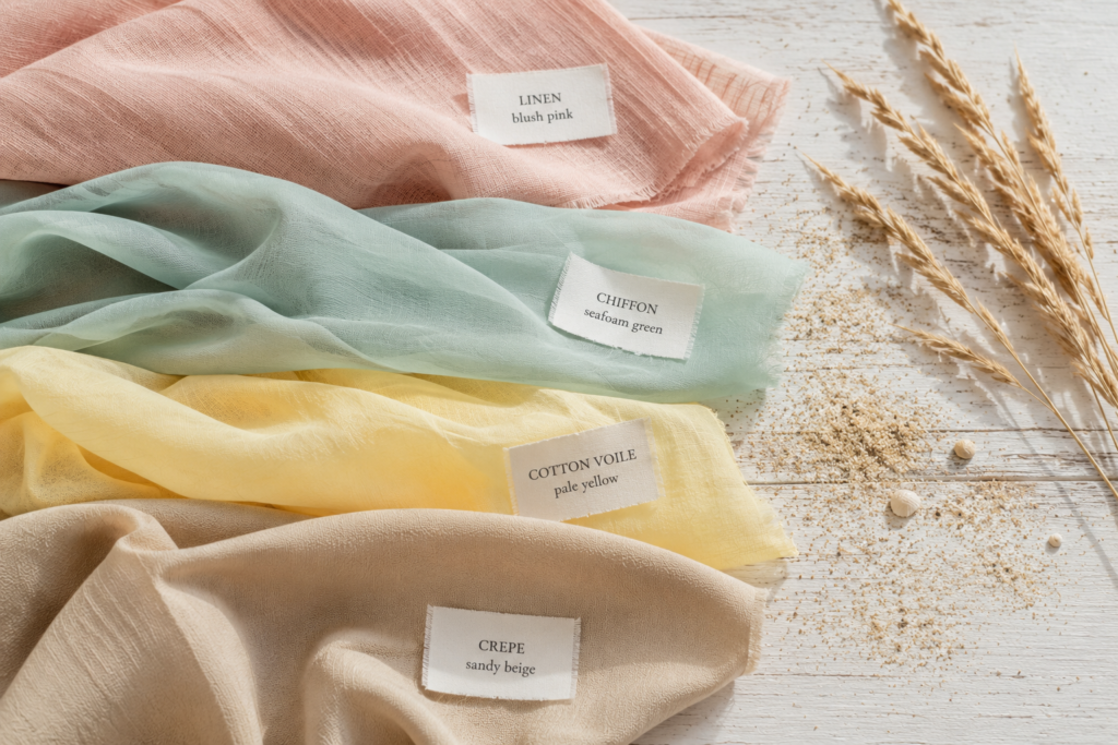 Fabric swatches for beach wedding guest dresses including linen, chiffon, and crepe