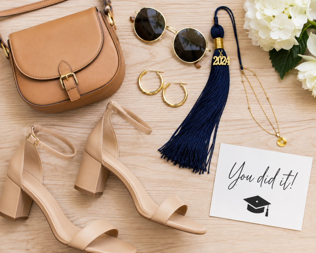 Flat lay of graduation day accessories including sandals, a crossbody bag, and sunglasses